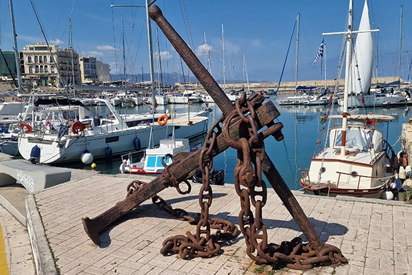 Heraklion old port sailing boats rusty anchor Crete harbor near car rental port